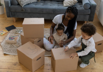 Image showing family decluttering with storage boxes (Image Credit: Familius)
