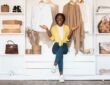 Young lady posing in front of a closet (Image Credit: Shutterstock)