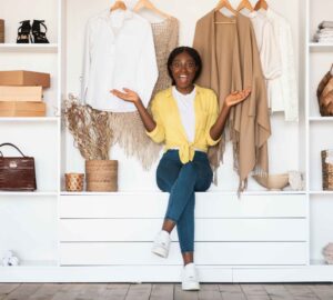 Young lady posing in front of a closet (Image Credit: Shutterstock)