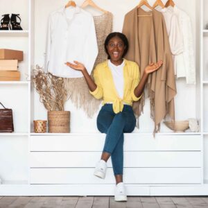 Young lady posing in front of a closet (Image Credit: Shutterstock)