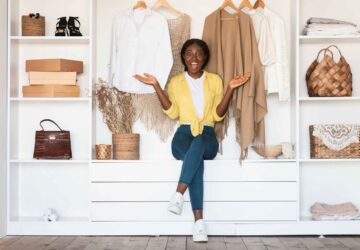 Young lady posing in front of a closet (Image Credit: Shutterstock)
