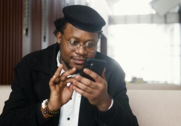 Man in Black Suit Jacket Holding Black Smartphone (Image Credit: Artem Podrez on Pexels)
