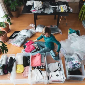A lady decluttering her home (Image Credit: Getty Images)