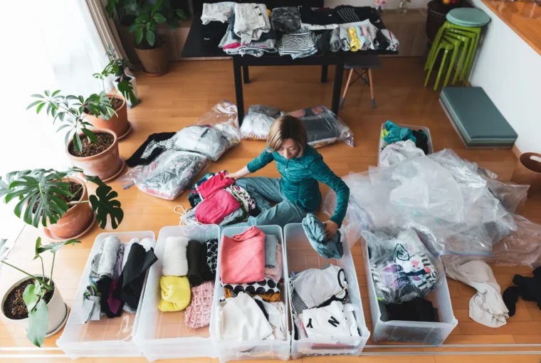 A lady decluttering her home (Image Credit: Getty Images)