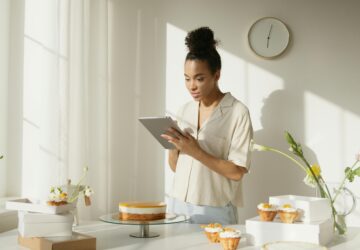 Image shows a lady using an Ipad