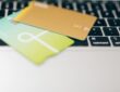 Close-Up Shot of Credit Cards on Laptop Keyboard (Image Credit: Photo by Leeloo The First)