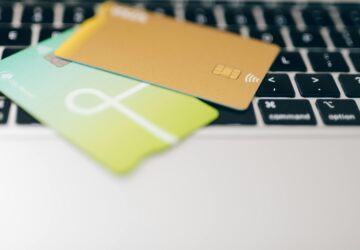 Close-Up Shot of Credit Cards on Laptop Keyboard (Image Credit: Photo by Leeloo The First)