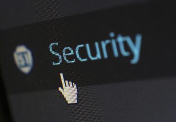 Image shows the mouse click hand pointing on a text with the word security
